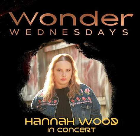 A headshot of musician Hannah Wood against a black background. Above the picture are the words 